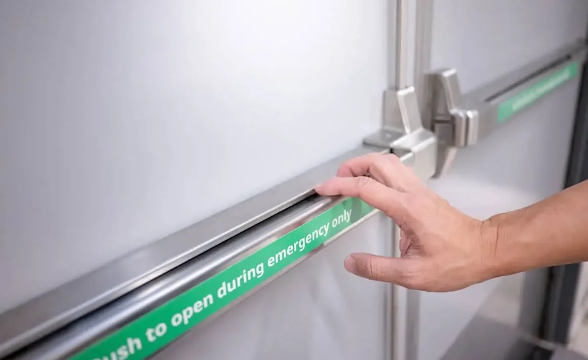 Panic bar installation on commercial double doors in Port St. Lucie